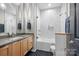 Modern bathroom with a vanity, a bathtub, and a glass shower door at 208 Wendover Heights Cir, Charlotte, NC 28211