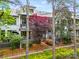 Charming home exterior with well-manicured landscaping, inviting porch, and picturesque surroundings at 208 Wendover Heights Cir, Charlotte, NC 28211