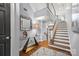 Beautiful foyer featuring hardwood floors, a decorative mirror, and a staircase at 208 Wendover Heights Cir, Charlotte, NC 28211