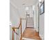 Beautiful stairway features hardwood steps and white railing at 208 Wendover Heights Cir, Charlotte, NC 28211
