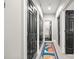 Well-lit hallway with modern doors and a colorful runner at 208 Wendover Heights Cir, Charlotte, NC 28211