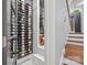 Elegant hallway featuring a wine rack, hardwood floors, and a staircase at 208 Wendover Heights Cir, Charlotte, NC 28211