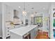 Well-equipped kitchen with stainless steel appliances, a spacious island, and elegant pendant lighting at 208 Wendover Heights Cir, Charlotte, NC 28211