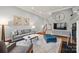 Cozy living room featuring a fireplace, hardwood floors, and neutral decor for a warm and inviting space at 208 Wendover Heights Cir, Charlotte, NC 28211