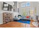 Bright living space with large windows, comfortable seating, and a wine rack for storage and display at 208 Wendover Heights Cir, Charlotte, NC 28211