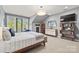 Cozy main bedroom with a comfy king bed, and a walk-out to a Juliet balcony at 208 Wendover Heights Cir, Charlotte, NC 28211
