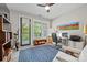 Bright home office with large windows, a ceiling fan, and an exercise bike at 208 Wendover Heights Cir, Charlotte, NC 28211