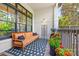 Cozy porch with comfortable seating and decorative plants, ideal for enjoying the outdoors at 208 Wendover Heights Cir, Charlotte, NC 28211