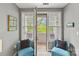 Bright sitting room with comfortable chairs and natural light, perfect for relaxing and enjoying the view at 208 Wendover Heights Cir, Charlotte, NC 28211