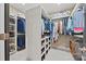 Spacious walk-in closet features custom shelving and ample hanging space for organized storage at 208 Wendover Heights Cir, Charlotte, NC 28211