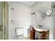Cozy bathroom featuring a toilet, sink, and shower, perfect for efficient use of space at 209 S Ransom St, Gastonia, NC 28052