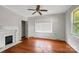 Bright bedroom with hardwood floors, a window, and a closet; ideal for relaxation and storage at 209 S Ransom St, Gastonia, NC 28052