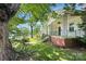 Charming home exterior with brick foundation, front porch, and landscaped yard at 209 S Ransom St, Gastonia, NC 28052