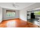 Inviting living room with hardwood floors, a window, and a partial view into the adjacent kitchen at 209 S Ransom St, Gastonia, NC 28052