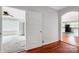 Open living area with hardwood floors connects to another room, offering a flexible living space at 209 S Ransom St, Gastonia, NC 28052