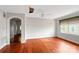 Living room with hardwood floors, archway, and natural light at 209 S Ransom St, Gastonia, NC 28052