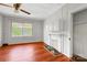 Bright living room featuring hardwood floors, fireplace, and natural light at 209 S Ransom St, Gastonia, NC 28052