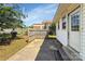 View of backyard patio with partial fence and landscaping at 209 S Ransom St, Gastonia, NC 28052