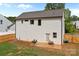 View of the backyard featuring a patio with outdoor seating and a newly installed wooden fence at 2535 Andes Dr, Statesville, NC 28625