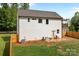 Picture of the backyard featuring a patio with outdoor seating, green grass, and a wooden fence at 2535 Andes Dr, Statesville, NC 28625