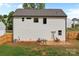 Home's backyard with patio, small seating, and privacy fencing at 2535 Andes Dr, Statesville, NC 28625
