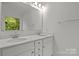 Bathroom features double sinks, white cabinets, and a large mirror with vanity lighting at 2535 Andes Dr, Statesville, NC 28625
