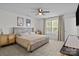 Bright bedroom featuring a ceiling fan, carpeted floors, and two windows with natural light at 2535 Andes Dr, Statesville, NC 28625