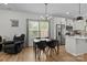 View of the dining area featuring a table with four chairs, adjacent to the kitchen at 2535 Andes Dr, Statesville, NC 28625