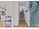 Inviting entryway with hardwood floors, staircase, and a decorative wreath on the front door at 2535 Andes Dr, Statesville, NC 28625