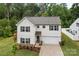 Well-maintained two-story home with landscaping, two-car garage, and manicured lawn at 2535 Andes Dr, Statesville, NC 28625