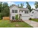 Two-story home with a fresh lawn, neat landscaping, and a two-car garage at 2535 Andes Dr, Statesville, NC 28625
