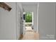 Bright foyer with coat closet featuring wood floors and view of the front yard at 2535 Andes Dr, Statesville, NC 28625