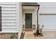 Inviting front door features a wreath, decorative accents, and a two-car garage at 2535 Andes Dr, Statesville, NC 28625