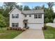 Well-maintained home featuring a two car garage, beautiful lawn, and a classic architecture at 2535 Andes Dr, Statesville, NC 28625