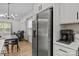 Kitchen area featuring a stainless steel refrigerator and a view of the living room at 2535 Andes Dr, Statesville, NC 28625