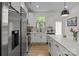 Bright kitchen featuring white cabinets, stainless steel appliances, and a center island at 2535 Andes Dr, Statesville, NC 28625