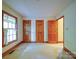 Bright bedroom featuring neutral carpet, natural light from the window and multiple closet doors at 2721 Tara Dr, Monroe, NC 28112