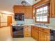 Kitchen featuring oak cabinets, countertops, stainless steel sink, and modern appliances at 2721 Tara Dr, Monroe, NC 28112