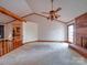 Large living room featuring a brick fireplace, and doorway entrance to kitchen at 2721 Tara Dr, Monroe, NC 28112