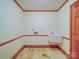 Empty utility room featuring base trim, outlet hookups, and hanging sink at 2721 Tara Dr, Monroe, NC 28112