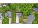 An aerial view showcasing a home with lush green landscaping and mature trees in a well-maintained neighborhood at 2835 24Th Street Ne Dr, Hickory, NC 28601