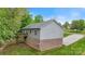 Back exterior view of home, showcasing a wooden deck and a partially brick facade at 2835 24Th Street Ne Dr, Hickory, NC 28601