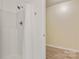 Bright, modern bathroom with white shower and new wood-look flooring at 2835 24Th Street Ne Dr, Hickory, NC 28601
