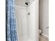Bathroom featuring a shower with blue patterned curtain and ceramic tile floor at 2835 24Th Street Ne Dr, Hickory, NC 28601