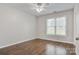 Bright bedroom with wood-look flooring, ceiling fan, natural light and neutral paint at 2835 24Th Street Ne Dr, Hickory, NC 28601
