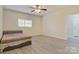 Bright bedroom with wood-look floors, ceiling fan and natural light from the window at 2835 24Th Street Ne Dr, Hickory, NC 28601