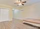A spacious bedroom featuring wood-look floors, ceiling fan, and air conditioning unit at 2835 24Th Street Ne Dr, Hickory, NC 28601