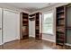 A walk-in closet equipped with built-in shelving and drawers for organized storage and a bright window with natural light at 2835 24Th Street Ne Dr, Hickory, NC 28601