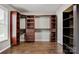 Large walk-in closet with custom shelves, drawers, wood flooring and clothing racks at 2835 24Th Street Ne Dr, Hickory, NC 28601