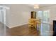 Bright dining room with hardwood floors, wooden table, and sliding door to the deck at 2835 24Th Street Ne Dr, Hickory, NC 28601